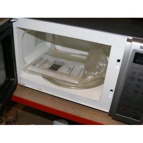 425 - SHARP MICROWAVE IN STEEL GREY WITH OPERATING MANUAL