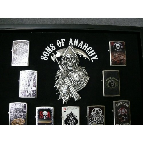 44 - A COLLECTION OF 9 SONS OF ANARCHY IN DISPLAY CASE  ZIPPO STYLE LIGHTERS