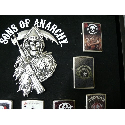 44 - A COLLECTION OF 9 SONS OF ANARCHY IN DISPLAY CASE  ZIPPO STYLE LIGHTERS