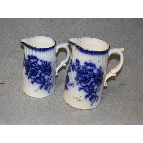 1 - PAIR OF VICTORIAN EARTHENWARE GRADUATED JUGS IN FLOW BLUE MARKED CLIFTON ENGLAND