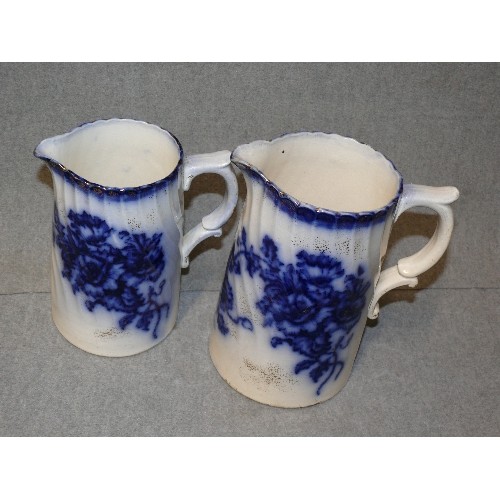 1 - PAIR OF VICTORIAN EARTHENWARE GRADUATED JUGS IN FLOW BLUE MARKED CLIFTON ENGLAND