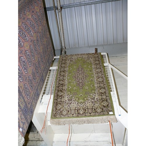 395 - A PATTERNED  OLIVE GREEN RUG