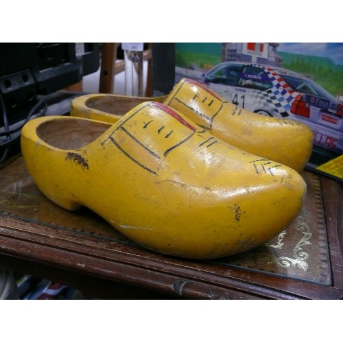 406 - A PAIR OF WOODEN CLOGS