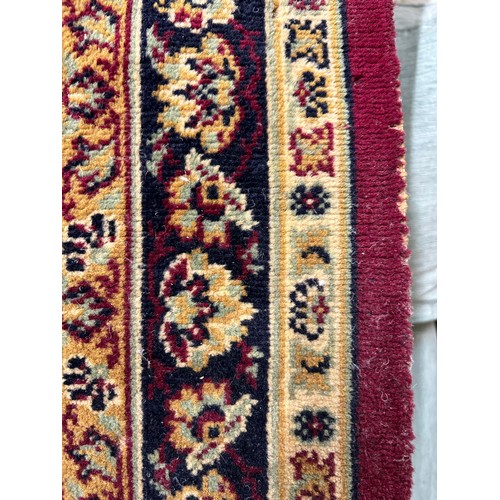 521 - A GOOD QUALITY TRADITIONAL ENGLISH WOOL PATTERNED CARPET 12FT X 9FT - GOLDS & CREAM AGAINST A RED GR... 