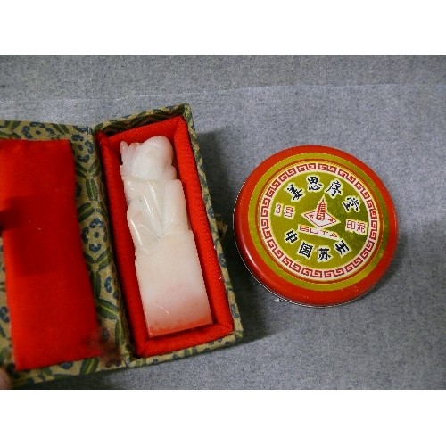 7 - A WHITE JADE HAND CARVED CHINESE SEAL WITH NOTE FROM MAKER PLUS TIN OF CHINESE SEAL WAX