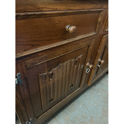 484 - OAK COURT CUPBOARD SIDEBOARD WITH LINENFOLD PANEL DOORS