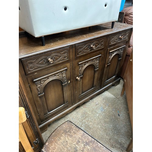 535 - DARK WOOD SIDEBOARD WITH PANELLED DOORS, CARVED DRAWERS. LOOSE KNOBS ARE INSIDE