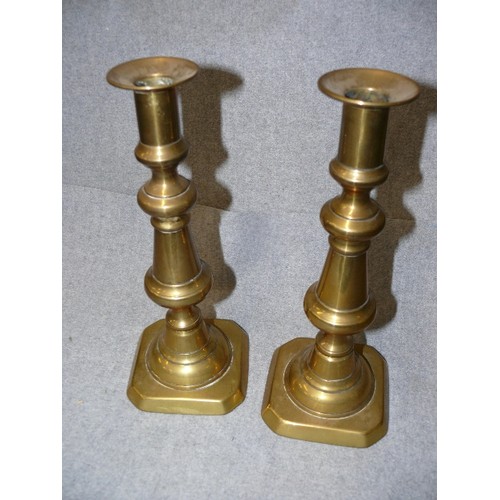 54 - A PAIR OF VICTORIAN BRASS CANDLESTICKS 25CM