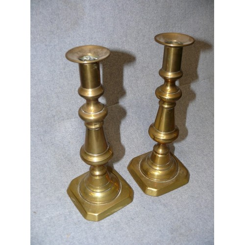 54 - A PAIR OF VICTORIAN BRASS CANDLESTICKS 25CM