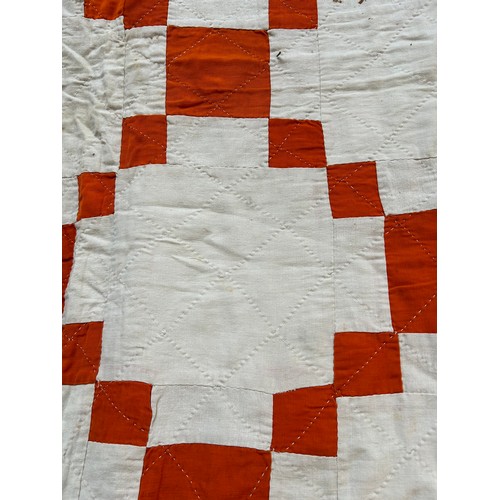 332 - A 1920's or 30's Irish Quilt in burnt orange & ivory chequered pattern & backed in ivory cotton. Has... 