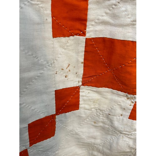 332 - A 1920's or 30's Irish Quilt in burnt orange & ivory chequered pattern & backed in ivory cotton. Has... 