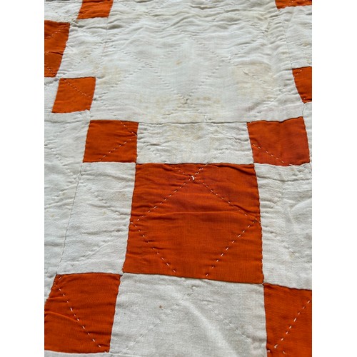 332 - A 1920's or 30's Irish Quilt in burnt orange & ivory chequered pattern & backed in ivory cotton. Has... 