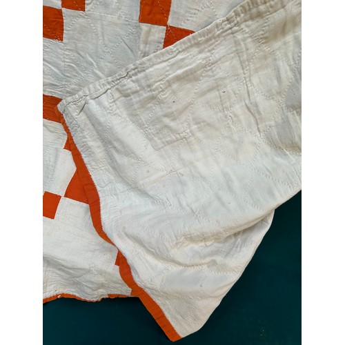 332 - A 1920's or 30's Irish Quilt in burnt orange & ivory chequered pattern & backed in ivory cotton. Has... 