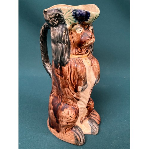 213 - 19th Century Staffordshire pottery King Charles Spaniel Toby  jug with majolica glaze - 23cm h