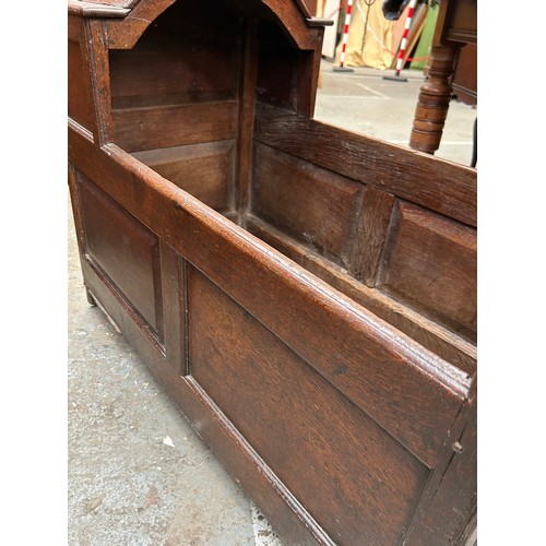 413 - An early 18th Century English Cradle or Crib in oak with paneled sides and arched hood - does not ha... 