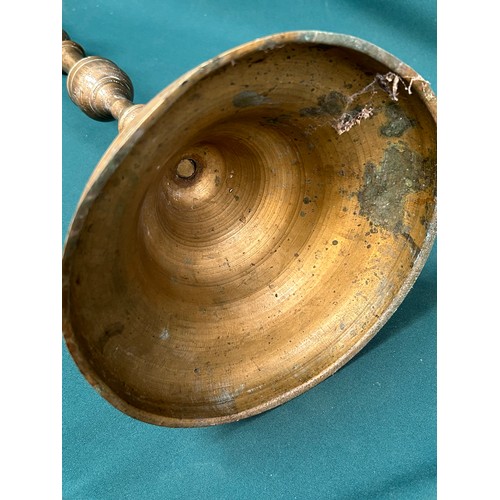 291 - A very large Persian engraved brass candlestick, probably 19th Century Qajar dynasty. The base finel... 