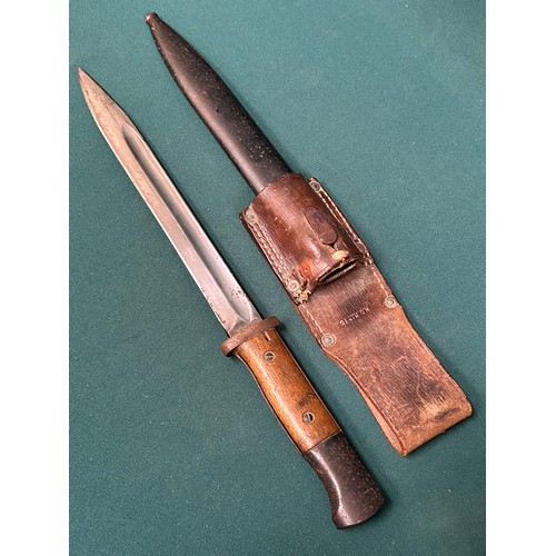 321 - A German Bayonet with single edge fullered blade marked S/155K wooden grip, metal scabbard with leat... 