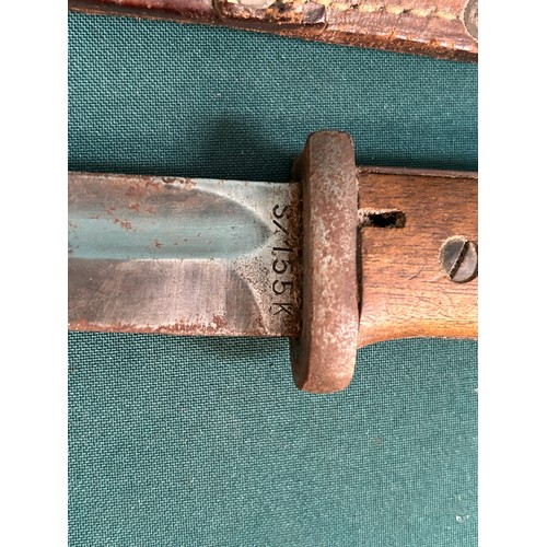 321 - A German Bayonet with single edge fullered blade marked S/155K wooden grip, metal scabbard with leat... 