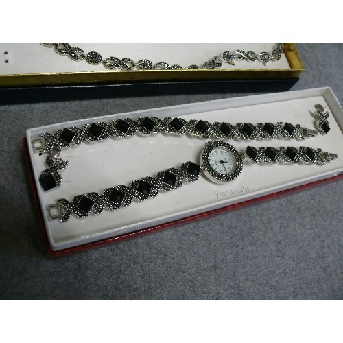 78 - A BOXED JEWELLERY SET WITH MATCHING WATCH, EARRINGS AND BRACELET PLUS A FURTHER SET OF BRACELETS