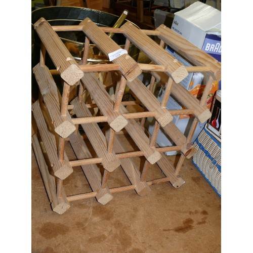 379 - A WOODEN WINE RACK