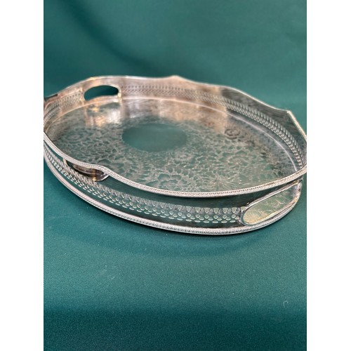 281 - A good quality English silver plated galleried oval tray engraved with flowers and foliage, marked 