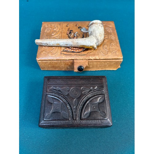 105 - A vintage Spanish leather box with contents of a clay pipe and another leather covered box with a to... 