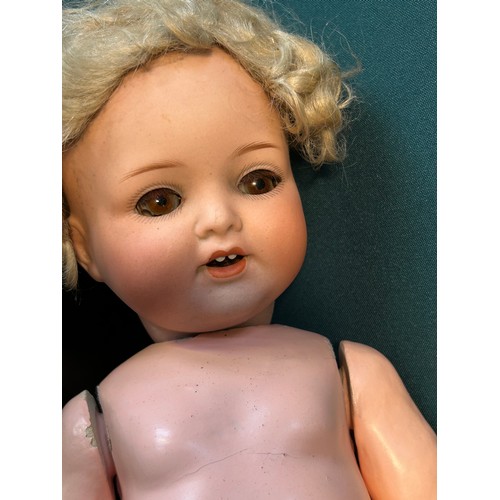 234 - An Edwardian Armand Marseille Koppelsdorf bisque headed doll with composition body - needs re jointi... 