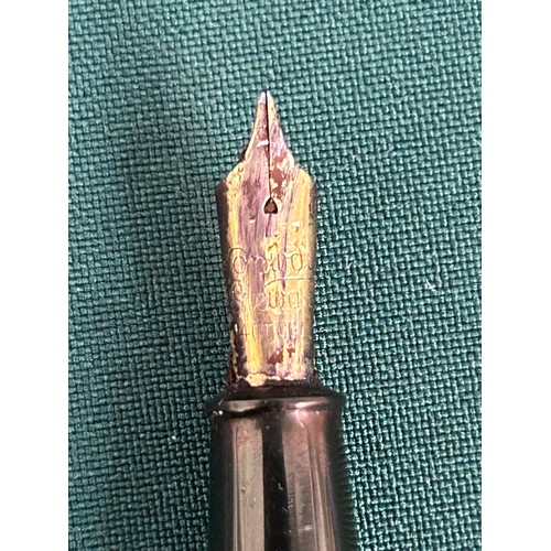 70 - A vintage Conway Stewart Fountain pen with a 14ct gold nib, also a dip ink pen with spare nibs and a... 