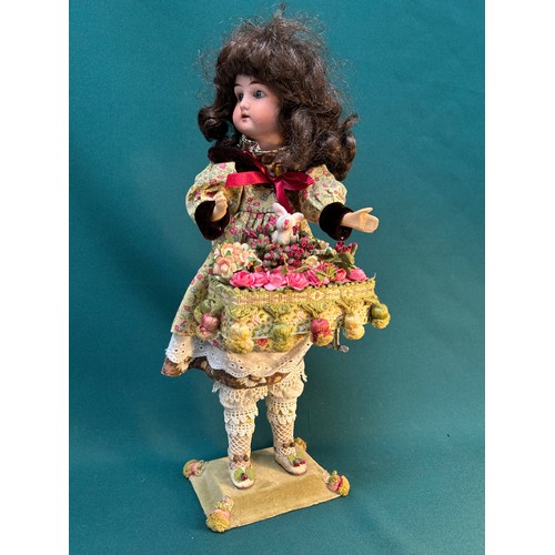 383 - A vintage automaton musical bisque headed doll - flower seller, with basket and rabbit - working ord... 