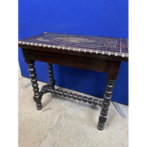 436 - An unusual Victorian Oak fold over card table with carved top and bobbin turned legs. The top hinged... 