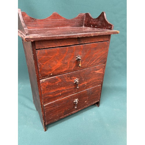 439 - An early 20th Century miniature stained pine chest of 3 drawers - 35cm x 22cm x 48cm