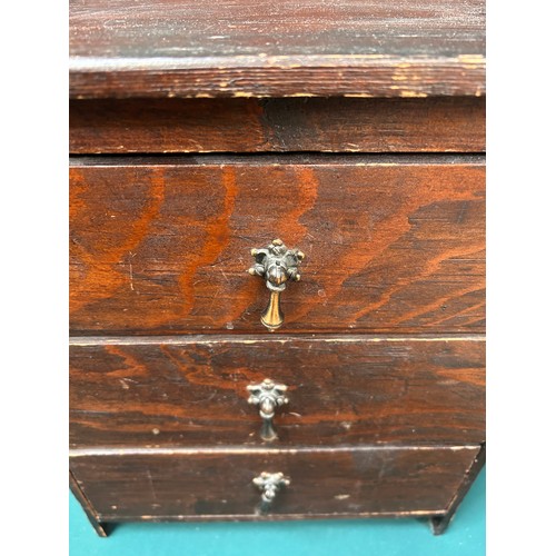 439 - An early 20th Century miniature stained pine chest of 3 drawers - 35cm x 22cm x 48cm