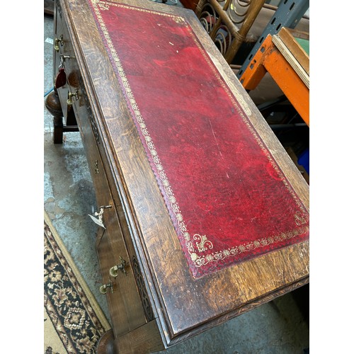 404 - 1920's oak desk with red leather top, 4 drawers with brass acorn drop handles (1 missing)