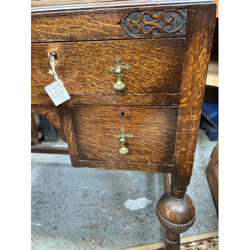 404 - 1920's oak desk with red leather top, 4 drawers with brass acorn drop handles (1 missing)