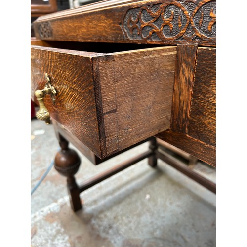 404 - 1920's oak desk with red leather top, 4 drawers with brass acorn drop handles (1 missing)