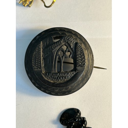 115 - Victorian and Edwardian mourning jewellery and accessories including an Irish bog oak 