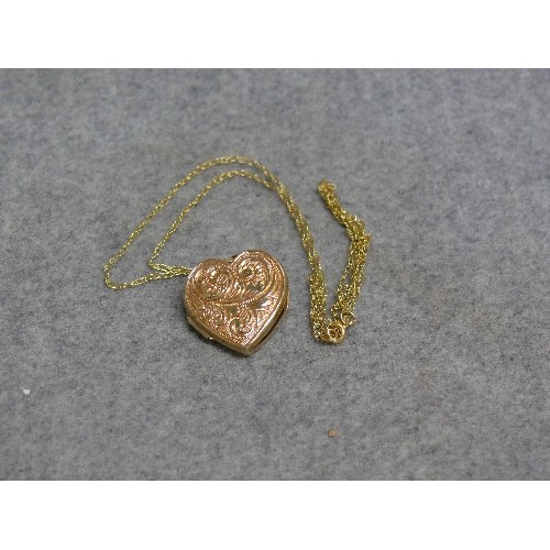 24 - A 9ct GOLD HEART SHAPE LOCKET ON A 9ct GOLD CHAIN WEIGHT 2.70gr