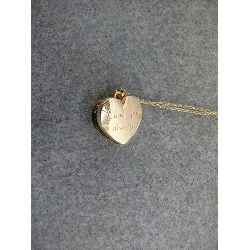 24 - A 9ct GOLD HEART SHAPE LOCKET ON A 9ct GOLD CHAIN WEIGHT 2.70gr