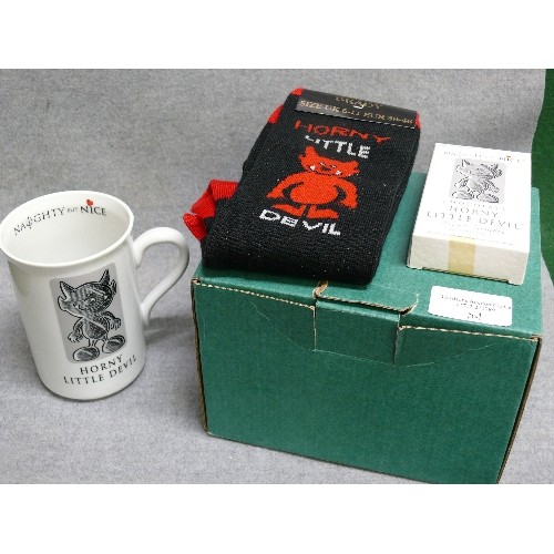 54 - A NOVELTY MUG HORNY LITTLE DEVIL AND A LITTLE EXTRAS PAIR OF HORNY SOCK PLUS BOX CHOCOLATE