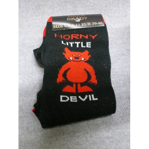 54 - A NOVELTY MUG HORNY LITTLE DEVIL AND A LITTLE EXTRAS PAIR OF HORNY SOCK PLUS BOX CHOCOLATE