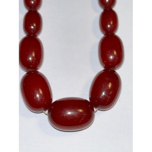 122 - NOTE DURING VIEWING LARGE NECKLACE BEADS HAVE BECOME DETACHED. A beautiful vintage long cherry amber... 