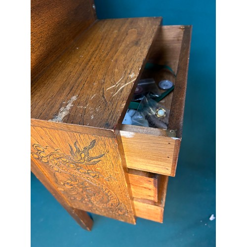 317 - An unusual 1940's or 50's hardwood sewing table carved in oriental style, with central box section w... 