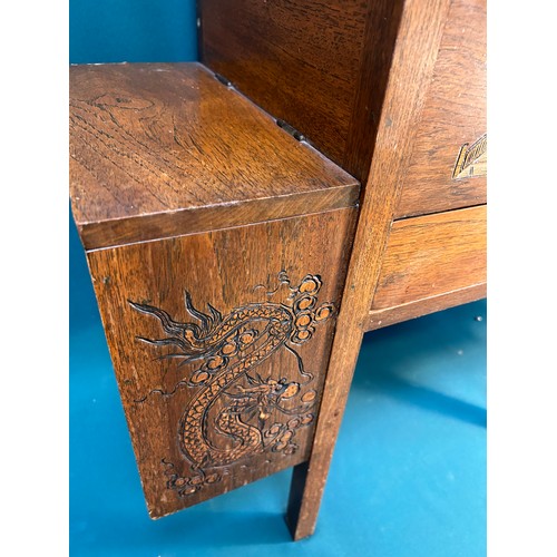 317 - An unusual 1940's or 50's hardwood sewing table carved in oriental style, with central box section w... 