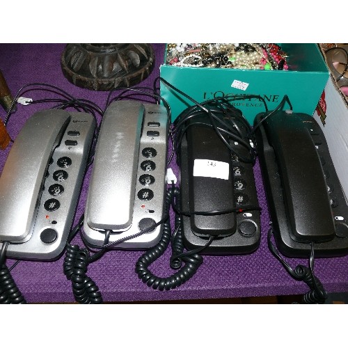 143 - A SET OF 4 GEEMARC PHONES