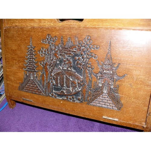 148 - A DECORATIVE CARVED WOODEN MAGAZINE RACK