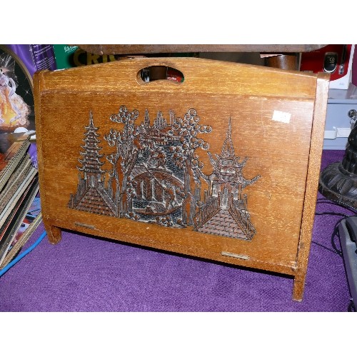 148 - A DECORATIVE CARVED WOODEN MAGAZINE RACK