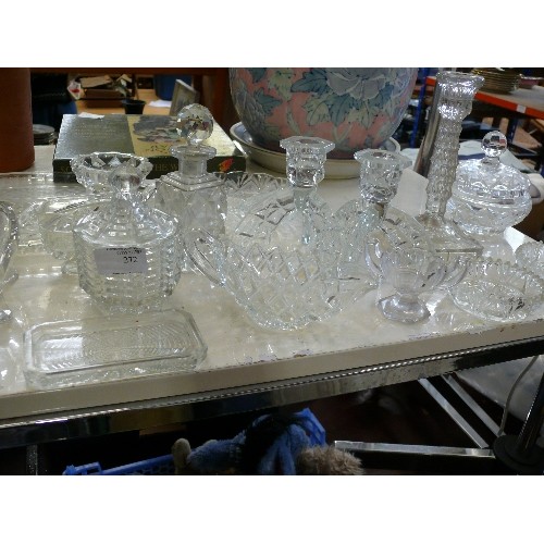 272 - A LARGE SELECTION OF VINTAGE CUT GLASS TO INCLUDE CANDLESTICKS, SCENT BOTTLES ETC