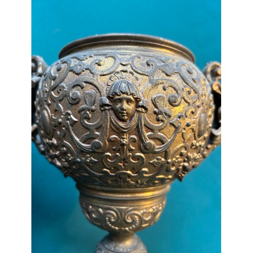 287 - A good pair of 19th Century cast gilt metal oil lamp bases on black marble stands, the goblet sectio... 