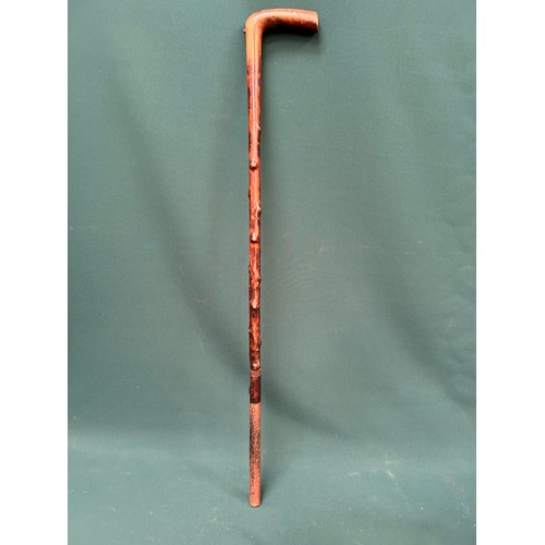 119A - An antique hawthorn walking stick with very old repairs in metal