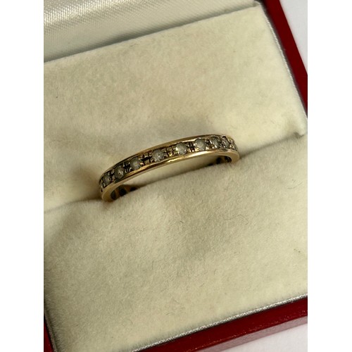 93 - A 9ct gold eternity ring set with clear stones